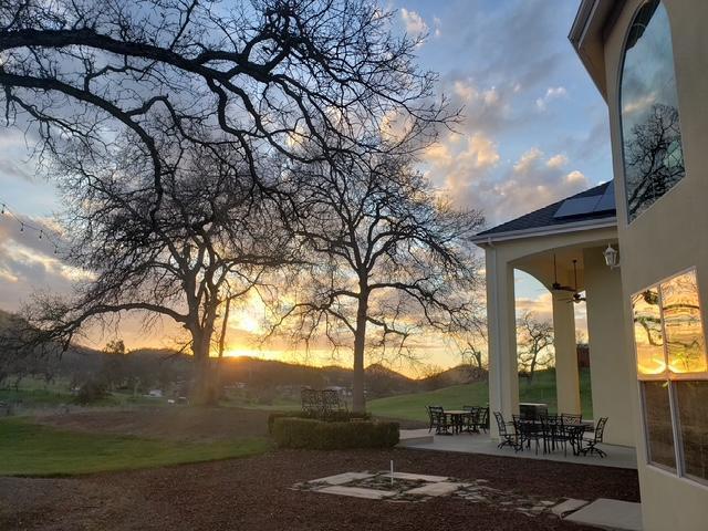 14505 Blue Drake Ln, Prather, CA 93651 - yard at dusk featuring a patio, ceiling fan, and outdoor dining space