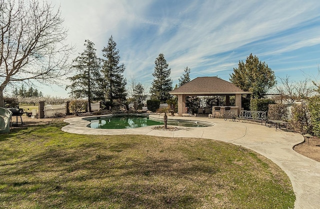 view of swimming pool featuring a fenced in pool, fence, a lawn, and a gazebo