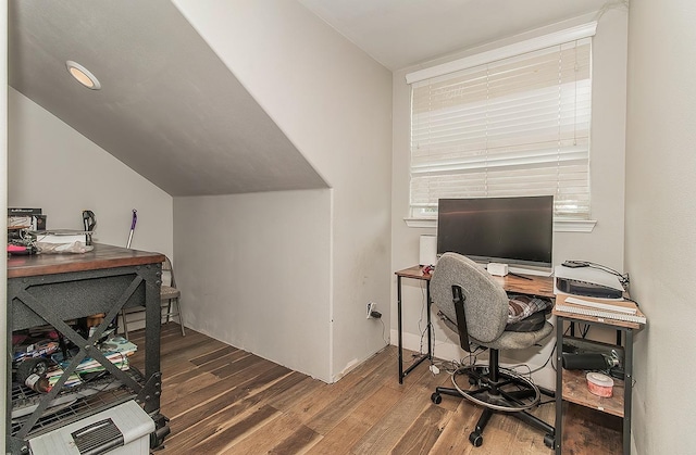 office space featuring vaulted ceiling and wood finished floors