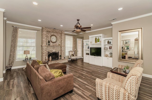 living room featuring ornamental molding, a fireplace, visible vents, and baseboards