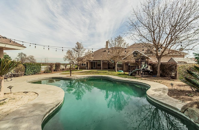 view of swimming pool with a fenced in pool and a patio area