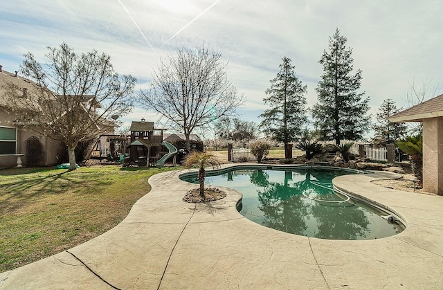 pool with a playground and a yard