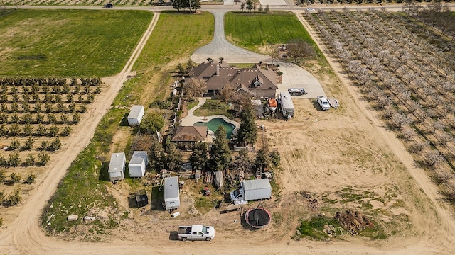 birds eye view of property featuring a rural view