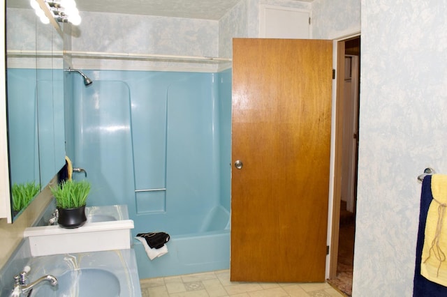 full bathroom featuring shower / washtub combination, double vanity, and a sink