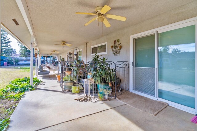 view of patio featuring ceiling fan