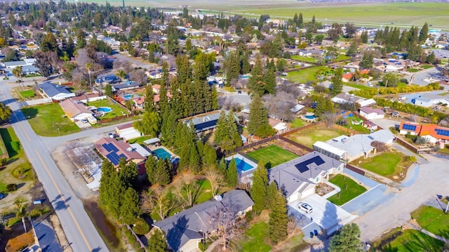 birds eye view of property with a residential view