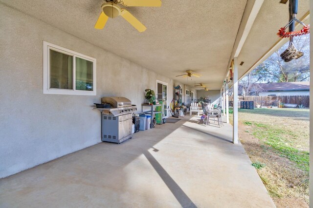 view of patio / terrace with ceiling fan, grilling area, and fence