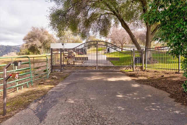 view of gate featuring fence