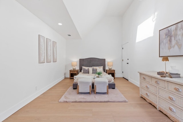 bedroom with lofted ceiling, light wood-style flooring, baseboards, and recessed lighting