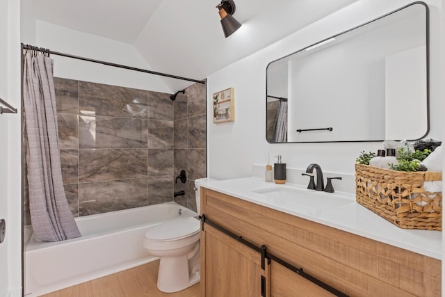 bathroom featuring toilet, wood finished floors, vanity, vaulted ceiling, and shower / bathtub combination with curtain