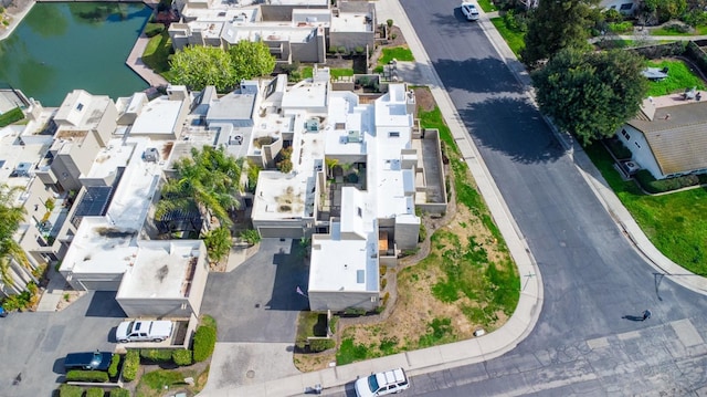 bird's eye view featuring a water view and a residential view