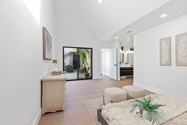 living area with high vaulted ceiling, recessed lighting, wood finished floors, visible vents, and baseboards