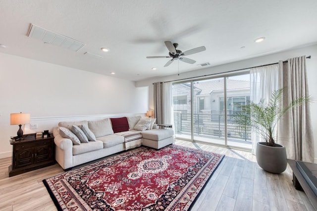 living room with ceiling fan, recessed lighting, visible vents, and light wood-style floors