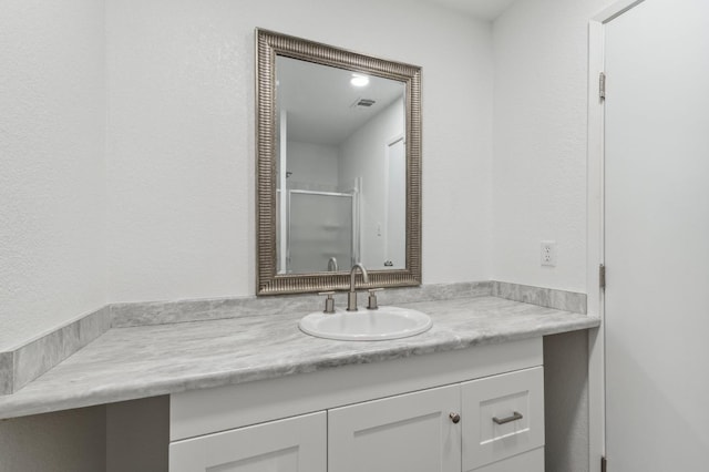 bathroom featuring visible vents and vanity