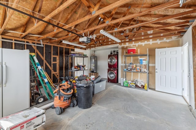 garage featuring a garage door opener, freestanding refrigerator, and gas water heater