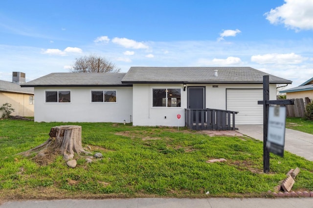 ranch-style home with a garage, a front lawn, concrete driveway, and stucco siding