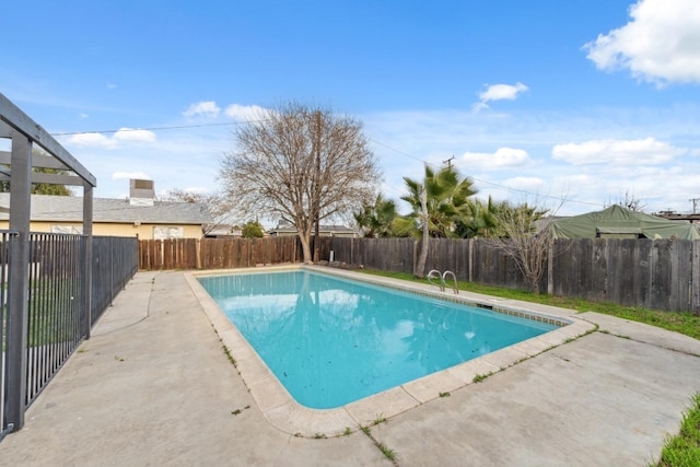 view of swimming pool featuring a fenced in pool, a patio area, and a fenced backyard