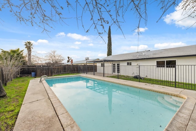 view of swimming pool with a patio area, a fenced backyard, and a fenced in pool