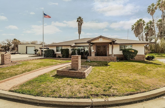 single story home with a garage, brick siding, an outdoor structure, and a front lawn