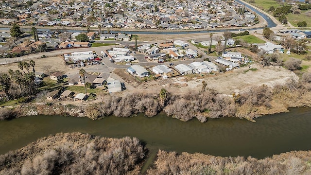 birds eye view of property featuring a water view and a residential view