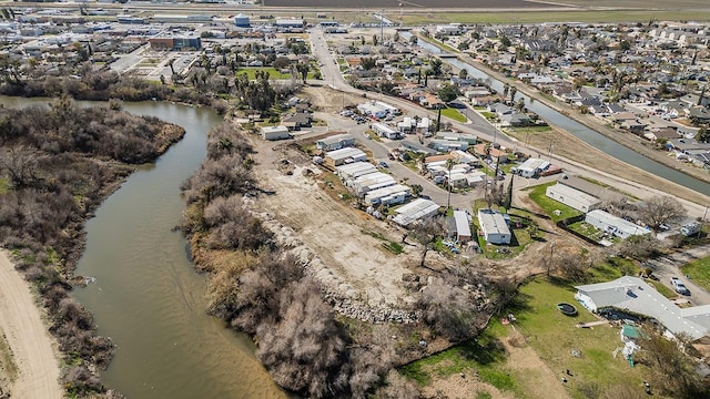 aerial view featuring a residential view and a water view