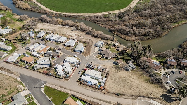 bird's eye view with a water view and a residential view