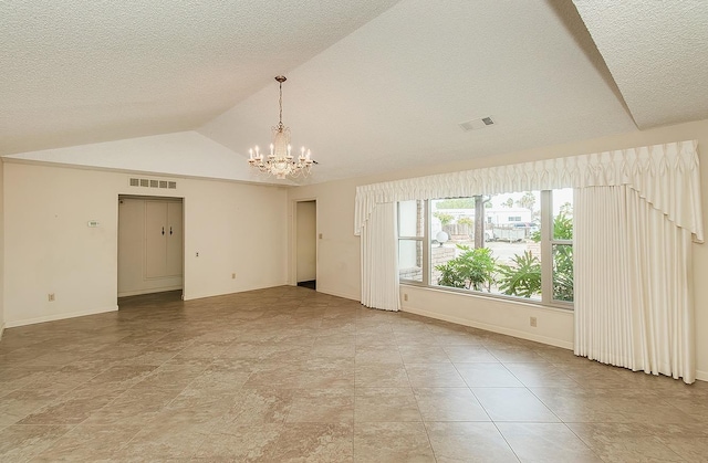 unfurnished room with lofted ceiling, baseboards, visible vents, and a notable chandelier