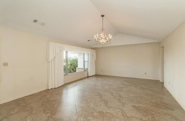 empty room featuring visible vents, baseboards, lofted ceiling, a textured ceiling, and a notable chandelier