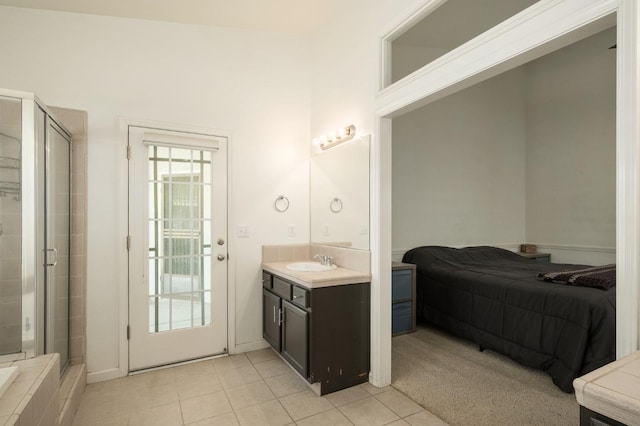 bathroom featuring a stall shower, tile patterned flooring, and vanity