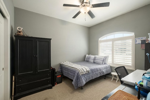 bedroom featuring light carpet and ceiling fan