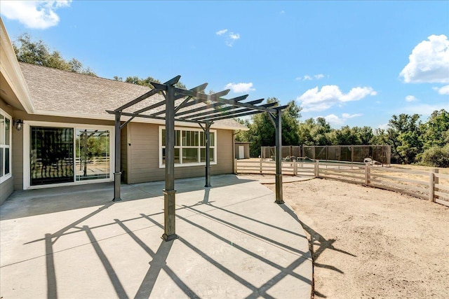 view of patio / terrace featuring fence and a pergola