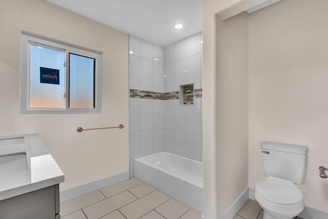 506 W Terrace Ave, Fresno, CA 93705 - full bath with baseboards, toilet, vanity, shower / bathtub combination, and tile patterned flooring