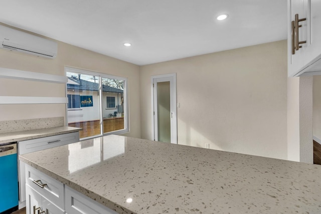 506 W Terrace Ave, Fresno, CA 93705 - kitchen featuring a wall mounted AC, dishwasher, white cabinetry, light stone countertops, and recessed lighting