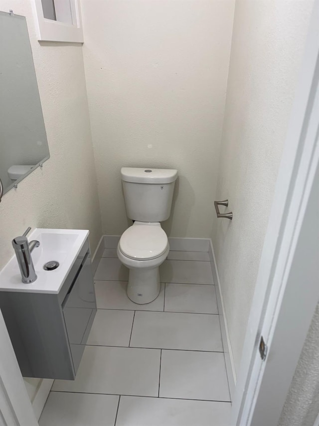 506 W Terrace Ave, Fresno, CA 93705 - half bath featuring toilet, tile patterned floors, vanity, and baseboards