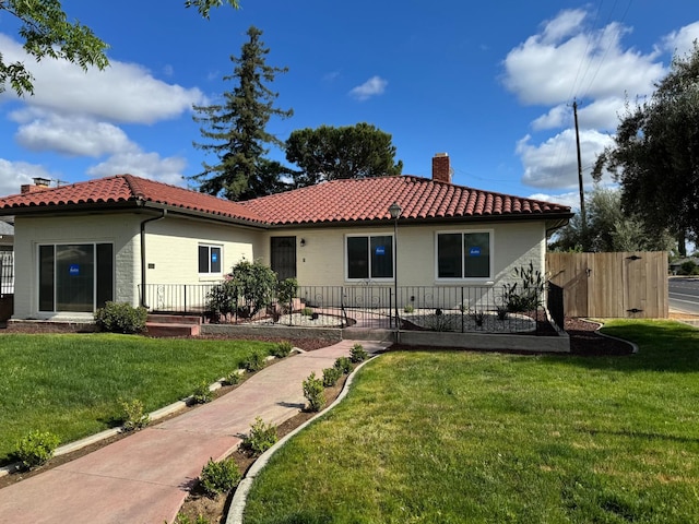 506 W Terrace Ave, Fresno, CA 93705 - rear view of property featuring a chimney and a tiled roof