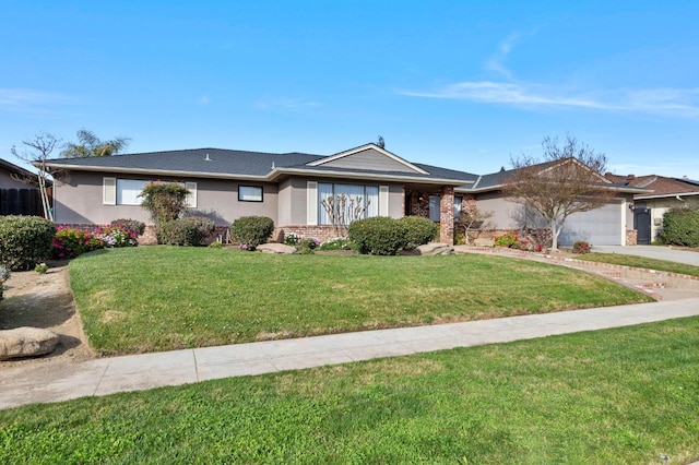 ranch-style house featuring an attached garage, brick siding, driveway, stucco siding, and a front yard