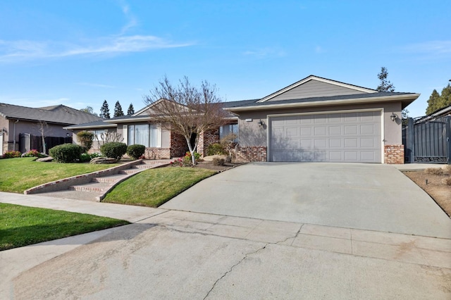 single story home with a front yard, brick siding, driveway, and an attached garage