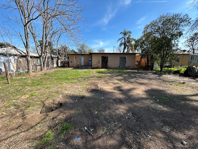 back of house with fence