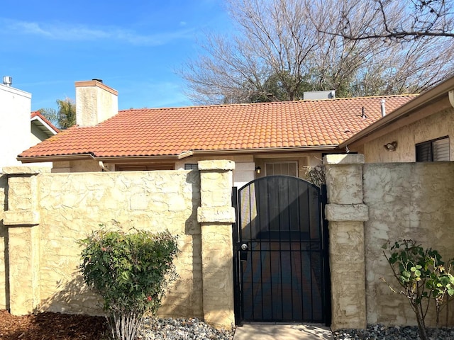 view of gate featuring fence