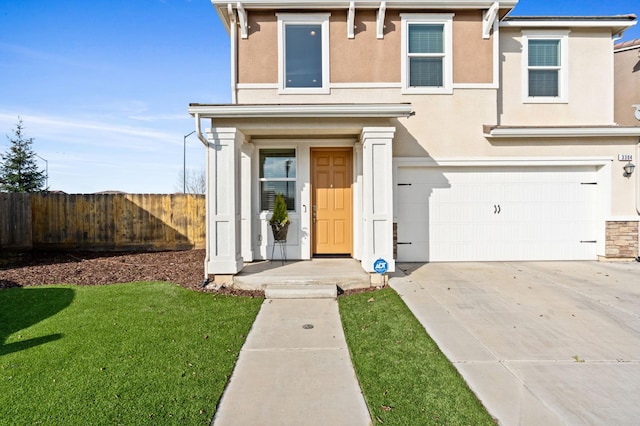 3384 Amanecer Ave, Clovis, CA 93619 - view of front of home with a garage, stucco siding, and driveway