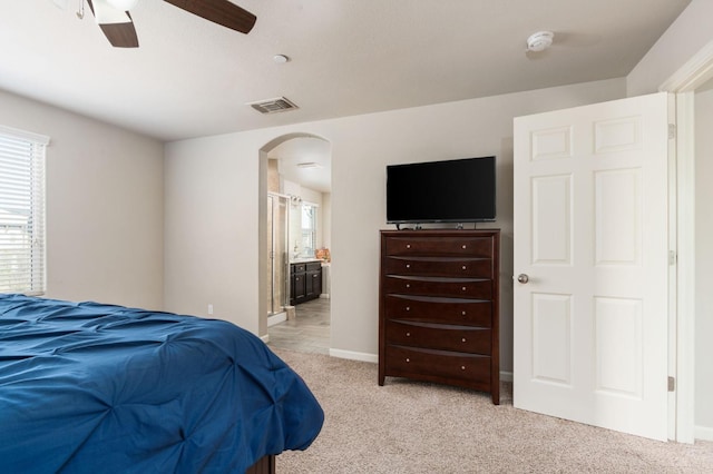 3384 Amanecer Ave, Clovis, CA 93619 - bedroom with arched walkways, multiple windows, and light colored carpet