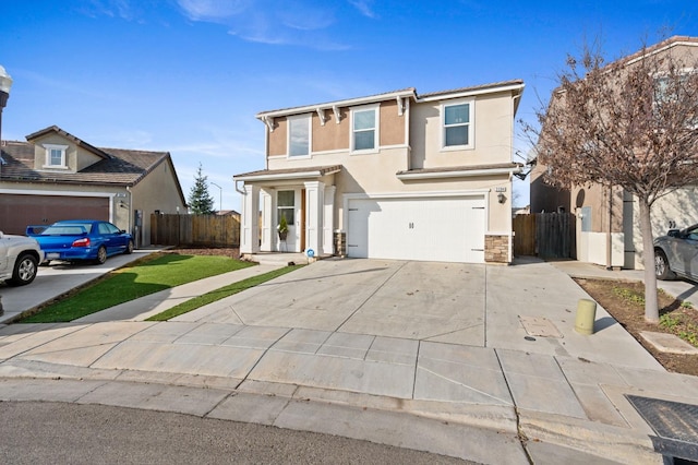 3384 Amanecer Ave, Clovis, CA 93619 - traditional-style house with concrete driveway, a garage, fence, and stucco siding