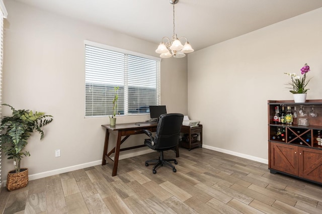 3384 Amanecer Ave, Clovis, CA 93619 - office featuring light wood-style flooring, a chandelier, and baseboards
