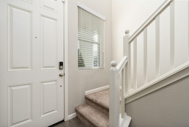 3384 Amanecer Ave, Clovis, CA 93619 - entryway featuring baseboards, stairs, and dark wood-type flooring