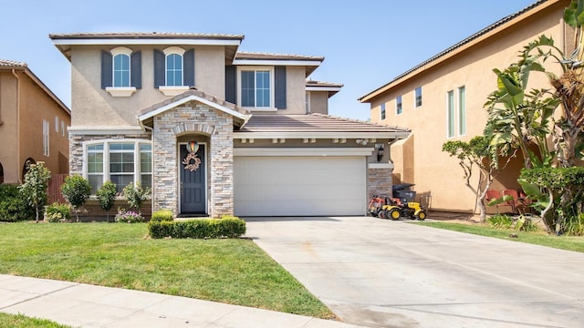 mediterranean / spanish-style house featuring a front yard, stone siding, driveway, and stucco siding