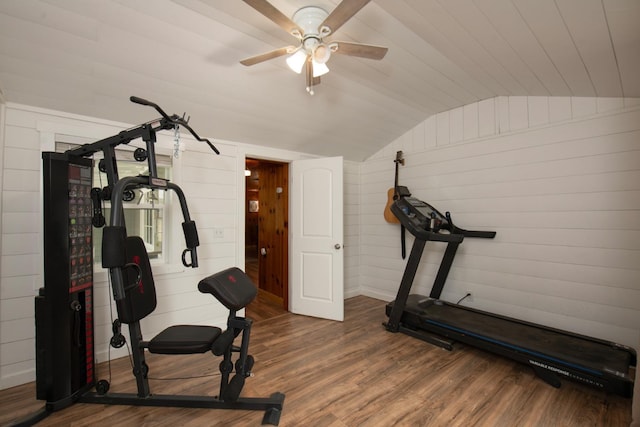 workout room featuring lofted ceiling, a ceiling fan, and wood finished floors