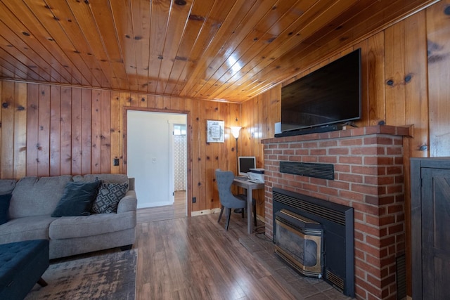 living room featuring wood walls, wood ceiling, baseboards, and wood finished floors