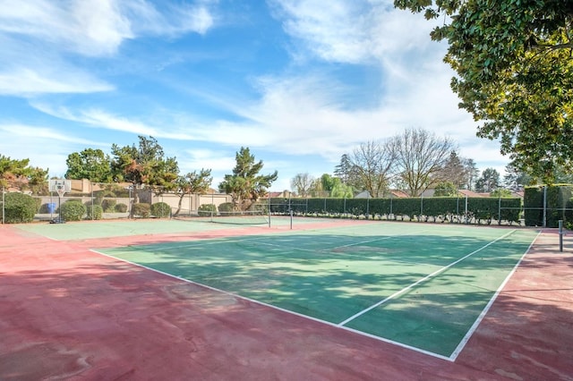 view of tennis court with fence