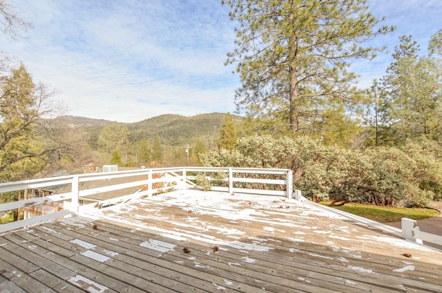 wooden deck with a mountain view