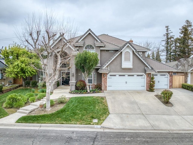 traditional home featuring an attached garage, brick siding, driveway, a tiled roof, and stucco siding